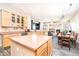 Spacious kitchen with island, connecting to dining area and fireplace, perfect for gatherings at 6920 W Tether Trl, Peoria, AZ 85383