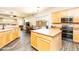 Open kitchen with a spacious island, connecting to a dining area for easy entertaining at 6920 W Tether Trl, Peoria, AZ 85383
