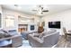 Cozy living room with a fireplace, comfortable seating, and an inviting atmosphere at 6920 W Tether Trl, Peoria, AZ 85383