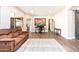 Spacious living room featuring modern flooring, natural light, and comfortable seating arrangement at 6920 W Tether Trl, Peoria, AZ 85383