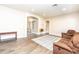 Open-concept living area with neutral tones, seamlessly connecting various living spaces at 6920 W Tether Trl, Peoria, AZ 85383