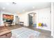 Bright living room with stylish decor, an open layout, and a designated workspace at 6920 W Tether Trl, Peoria, AZ 85383