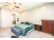 Spacious bedroom with neutral walls and carpet, featuring a comfortable bed at 6920 W Tether Trl, Peoria, AZ 85383