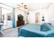 Bright bedroom with a view to the backyard and ensuite bathroom at 6920 W Tether Trl, Peoria, AZ 85383