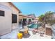 A safe backyard with a pool, patio, and play area at 6920 W Tether Trl, Peoria, AZ 85383