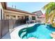 Inviting backyard pool with a covered patio, perfect for outdoor relaxation and entertaining at 6920 W Tether Trl, Peoria, AZ 85383
