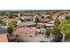 Aerial shot of a home in a suburban neighborhood with a pool and backyard at 7015 S Stadium Ct, Gilbert, AZ 85298