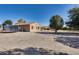 Large backyard with gravel, a trampoline, and a glimpse of the in-ground pool at 7015 S Stadium Ct, Gilbert, AZ 85298