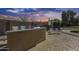 Outdoor kitchen and grill with chairs in a spacious backyard, perfect for entertaining friends and Gathering at 7015 S Stadium Ct, Gilbert, AZ 85298