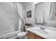 Compact bathroom featuring a bathtub with shower curtain, toilet, and vanity with a neutral color scheme at 7015 S Stadium Ct, Gilbert, AZ 85298