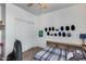 Bedroom with a ceiling fan, a bed with built-in storage, and wall decor in a cozy setting at 7015 S Stadium Ct, Gilbert, AZ 85298