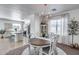 Open dining area with natural light, chandelier and flowing seamlessly into the adjacent kitchen at 7015 S Stadium Ct, Gilbert, AZ 85298