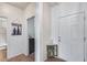 Bright entryway with a neutral color scheme and tile flooring, leading to other rooms in the home at 7015 S Stadium Ct, Gilbert, AZ 85298