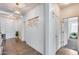 Bright entryway with tile flooring, neutral walls, decorative lighting, and stylish decor at 7015 S Stadium Ct, Gilbert, AZ 85298