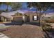 Beautifully landscaped home with a two-car garage, appealing facade, and convenient driveway at 7015 S Stadium Ct, Gilbert, AZ 85298