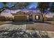 Inviting single-story home boasting a two-car garage and attractive desert landscaping at 7015 S Stadium Ct, Gilbert, AZ 85298
