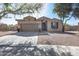 Charming single-story home with a two-car garage and low-maintenance landscaping at 7015 S Stadium Ct, Gilbert, AZ 85298