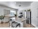 Modern kitchen with stainless steel appliances, island seating, and ample counter space at 7015 S Stadium Ct, Gilbert, AZ 85298