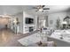 Cozy living room featuring modern decor, a fireplace, and an open layout at 7015 S Stadium Ct, Gilbert, AZ 85298