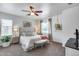Inviting main bedroom with soft carpet, a ceiling fan, and natural light from the window at 7015 S Stadium Ct, Gilbert, AZ 85298