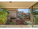 Enjoy community views from this balcony with orange railings and the mature palms in the foreground at 7137 E Rancho Vista Dr # 6009, Scottsdale, AZ 85251