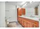 Bathroom featuring double sinks, cabinetry, a toilet and a mirror at 7137 E Rancho Vista Dr # 6009, Scottsdale, AZ 85251