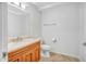 Neutral bathroom with tiled floor, a wooden vanity, and a white toilet at 7137 E Rancho Vista Dr # 6009, Scottsdale, AZ 85251