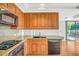 Kitchen with granite countertops, wood cabinets, and stainless steel appliances at 7137 E Rancho Vista Dr # 6009, Scottsdale, AZ 85251