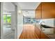 Modern kitchen with hardwood floors, wood cabinets, and stainless steel appliances with lots of natural light at 7137 E Rancho Vista Dr # 6009, Scottsdale, AZ 85251