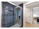 Beautifully tiled walk-in shower with glass door, mosaic tile floor and shower niche at 7151 E Rancho Vista Dr # 2006, Scottsdale, AZ 85251