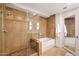 Luxurious bathroom showcasing a glass-enclosed shower and a relaxing soaking tub at 7151 E Rancho Vista Dr # 2006, Scottsdale, AZ 85251