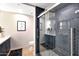 Modern bathroom with glass shower, herringbone tiling, and stylish fixtures and a contrasting vanity at 7151 E Rancho Vista Dr # 2006, Scottsdale, AZ 85251