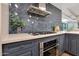 This kitchen features stainless steel appliances, including a gas cooktop and built in oven with designer backsplash at 7151 E Rancho Vista Dr # 2006, Scottsdale, AZ 85251