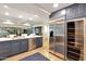 Modern kitchen features stainless steel appliances, blue cabinets, tile floors, and a large island with seating at 7151 E Rancho Vista Dr # 2006, Scottsdale, AZ 85251