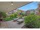 Charming outdoor patio featuring lounge chairs and lush landscaping, great for relaxation at 7151 E Rancho Vista Dr # 2006, Scottsdale, AZ 85251