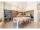 The spacious kitchen features an island with seating, pendant lighting, and high-end stainless steel appliances at 7739 E Evening Glow Dr, Scottsdale, AZ 85266