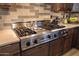 This gourmet kitchen is equipped with stainless steel appliances, a Viking range, and warm wood cabinetry at 7739 E Evening Glow Dr, Scottsdale, AZ 85266