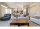 Open-concept living room flowing into a modern kitchen and dining area at 7739 E Evening Glow Dr, Scottsdale, AZ 85266