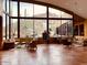 Lobby seating area with comfortable couches and armchairs, complemented by large windows with desert views at 7739 E Evening Glow Dr, Scottsdale, AZ 85266