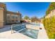A custom pool and spa with a desert view and blue skies at 7739 E Evening Glow Dr, Scottsdale, AZ 85266