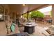 Outdoor patio with plush seating and mature landscaping at 7942 E Nopal Ave, Mesa, AZ 85209