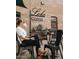 Inviting coffee shop exterior with outdoor seating and unique signage at 81 W Lynwood St, Phoenix, AZ 85003