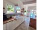 Bright kitchen featuring a farmhouse sink, wood counters, and a view to the pool area at 81 W Lynwood St, Phoenix, AZ 85003