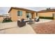 Relaxing back patio with comfortable seating, dining area, and serene views at 8210 S 132Nd Ave, Goodyear, AZ 85338