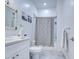 Well-lit bathroom featuring a shower/tub combo with a whale-patterned curtain and a white vanity at 8210 S 132Nd Ave, Goodyear, AZ 85338
