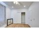 Bright bedroom with hardwood floors, closet, and access to a private bathroom at 8210 S 132Nd Ave, Goodyear, AZ 85338
