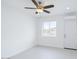 Bright bedroom features a ceiling fan, scenic views, and a cozy atmosphere at 8210 S 132Nd Ave, Goodyear, AZ 85338