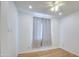 Bedroom featuring hardwood floors, ceiling fan, and neutral wall colors at 8210 S 132Nd Ave, Goodyear, AZ 85338