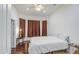 Comfortable bedroom featuring hardwood floors, white walls, and natural light at 8210 S 132Nd Ave, Goodyear, AZ 85338