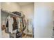 Functional closet with ample hanging space, shelving, and a full-length mirror for organization and convenience at 8210 S 132Nd Ave, Goodyear, AZ 85338
